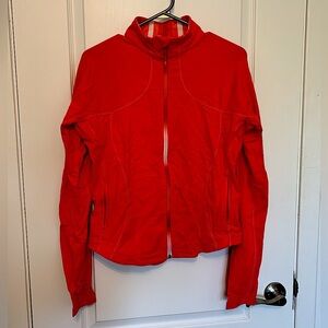 Lululemon full zip sweater, pink/coral in colour, size unknown,fits like medium
